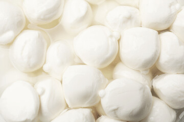 Tasty mozzarella cheese balls as background, closeup