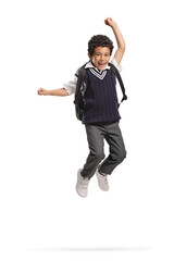 Happy asian schoolboy in a uniform jumping
