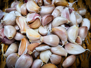 Fresh organic garlic on brown background.