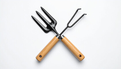 Naklejka premium against a bright backdrop, two gardening implements are positioned in a crossed arrangement. one item has a dark, three pronged end, while the other has two curved tines