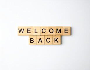 Text WELCOME BACK on wooden cubes on white background. Square wood blocks. Top view, flat lay.