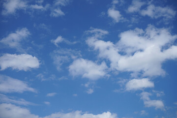 Blue sky with fluffy clouds.
