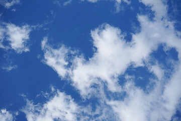 Blue sky with fluffy clouds.