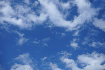 Blue sky with fluffy clouds.