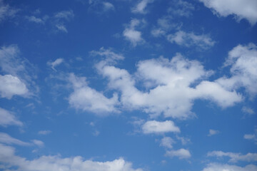 Blue sky with fluffy clouds.