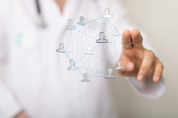 Doctor using digital interface connecting patients.  Healthcare network concept.