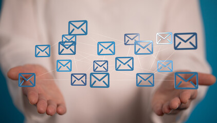 Hand holding digital email icons, illustrating global communication and network.