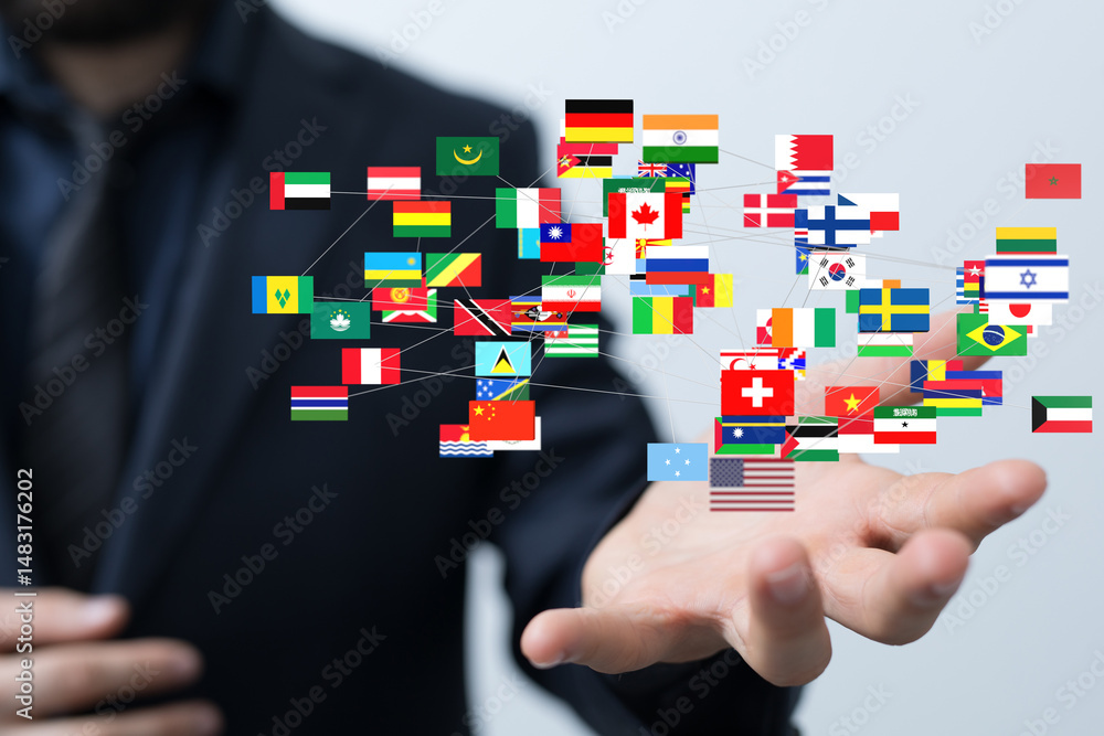 Poster image of a businessman's hand displaying a network of interconnected flags, symbolizing global busin