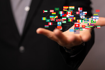 Image of a hand holding a network of interconnected flags, symbolizing global business, international trade, and worldwide connections.