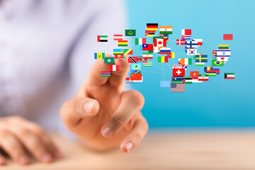 Image of a hand interacting with a network of interconnected world flags, symbolizing global...