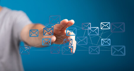 Hand interacting with digital email icons. Network, communication, technology concept.