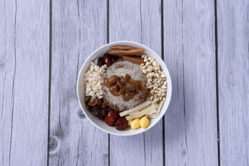 Sweet drinks made from milk, cocoa, coffee and fruit syrup are placed on a wooden table.