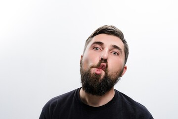 Man with beard making a funny face
