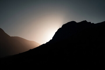 015-049-Clouds-110-_mountain_pass_silhouetted_against_the_setting_s