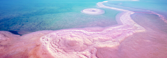 Dead Sea salty shore. Texture of the Dead Sea. Sea nature background. Horizontal banner