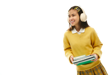 Bright and cheerful schoolgirl in stylish uniform enjoying her time in the studio