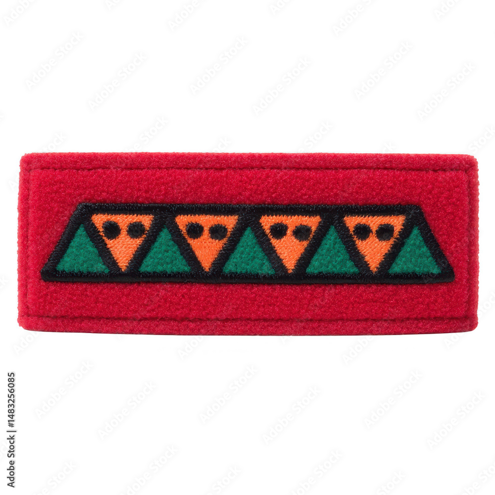 Poster This shows red fabric patch with geometric design featuring alternating green and orange triangles. pattern is simple and symmetrical, creating bold visual effect.Red fabric patch with geometric