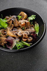 Champignon mushrooms pickled salad snack fresh gourmet food background on the table rustic food top view copy space vegetarian vegan food