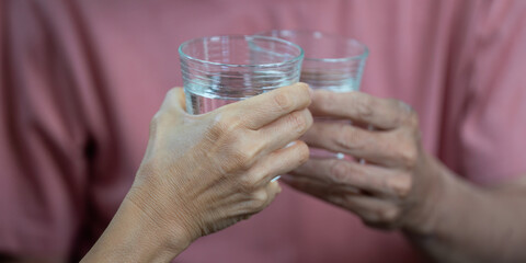 Wellness and Togetherness. Elderly couple enjoying healthy lifestyle with glasses of water.