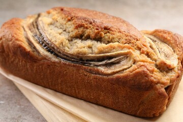 Delicious homemade banana bread on grey table, closeup