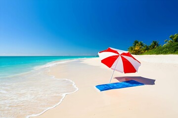 Tropical beach scene with colorful umbrella and towel on white sand under blue sky