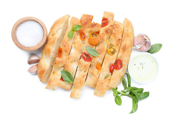 Cut delicious focaccia with tomatoes, spices and oil isolated on white, top view
