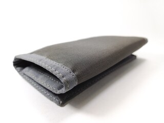 close up of a wallet made of polyester material on a white background