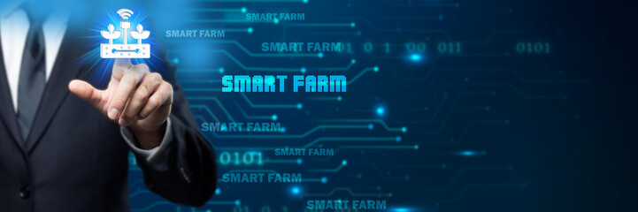 Obraz premium Businessman interacts with a glowing smart farm icon in a digital, futuristic environment, symbolizing agricultural technology, data-driven farming, precision agriculture, and the future .