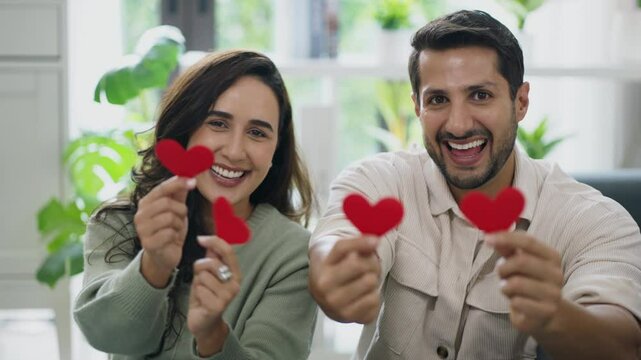 Joyful couple sharing a touching gesture of love, expressing romantic feelings and emotional bond at home.
