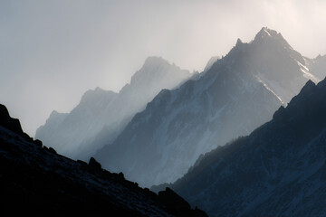 015-049-Clouds-564-Silhouette_of_mountains_glowing_with_alpine_ligh