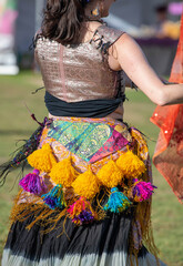 Colorful costume with tassels and embroidery at outdoor cultural event