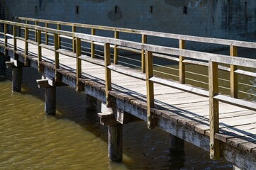 Wooden footbridge leading to medieval castle over moat