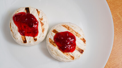 Grilled camembert cheese on plate