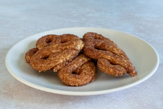 All Butter Cinnamon Sugar Knot biscuits or krakeling sweet snack served ion plate