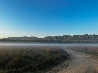 Landscape of hills and grassland with river of jim corbett national park.