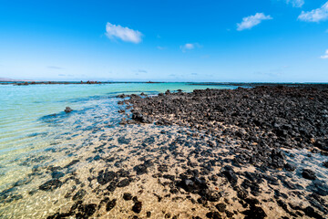 Curtains Beautiful white beach Caletón Blanco with turquoise ocean water on Lanzarote, Canary Islands. Holidays in Spain.