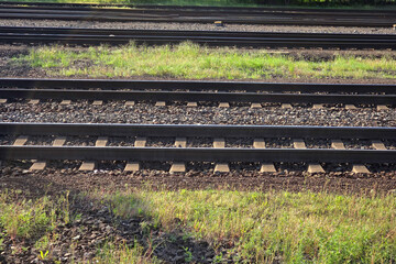 Railway Tracks in Green Landscape for Transportation and Travel Concepts