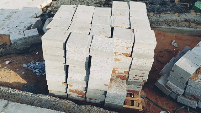 Interlock, Small bricks tile of pavement area, Interlock on construction site. Interlock on construction site. Interlock pallet on construction site used for walking pathway or Padestrian crossing