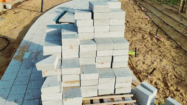 Interlock, Small bricks tile of pavement area, Interlock on construction site. Interlock on construction site. Interlock pallet on construction site used for walking pathway or Padestrian crossing