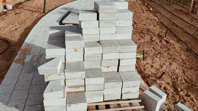 Interlock, Small bricks tile of pavement area, Interlock on construction site. Interlock on construction site. Interlock pallet on construction site used for walking pathway or Padestrian crossing