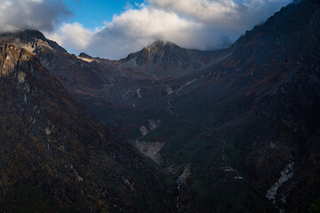 Fototapeta premium Early Morning Sunrise in the Himalayan Mountains with Cloud Shadows in Gosaikunda, Langtang, Nepal