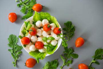 Light snack of mozzarella and cherry tomatoes in a bowl