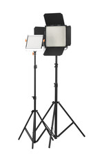 Professional lighting equipment with tripods isolated on white