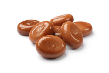 Tasty sweet caramel candies isolated on white