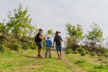 Family Hiking Adventure with Child  on Mountain Summit