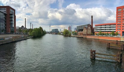 Obraz premium Urban river landscape with architecture and trees, panoramic Berlin view for headers