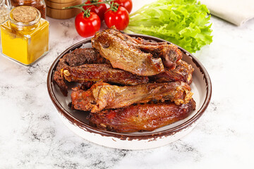 Roasted duck wings with sauce
