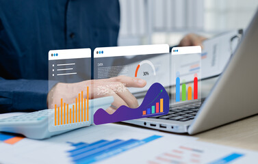 Businessman analyzing financial balance sheet and profit report graph of company in office,...