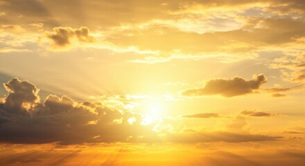 Fototapeta premium Golden sky representing hope and serenity, with clouds and bright sunlight