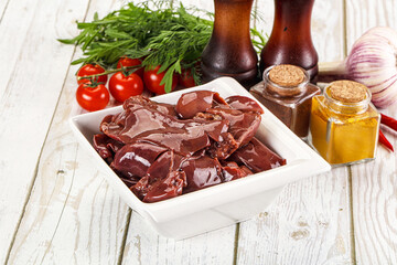 Raw chicken liver uncooked in the bowl